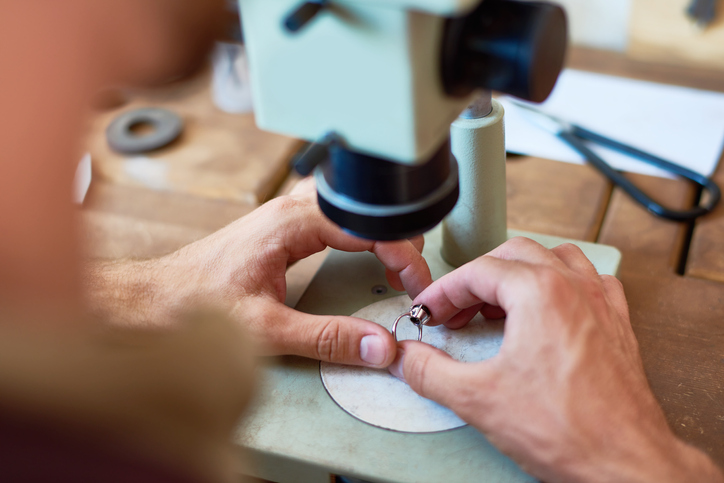 jewelry appraiser inspecting jewelry for appraisal