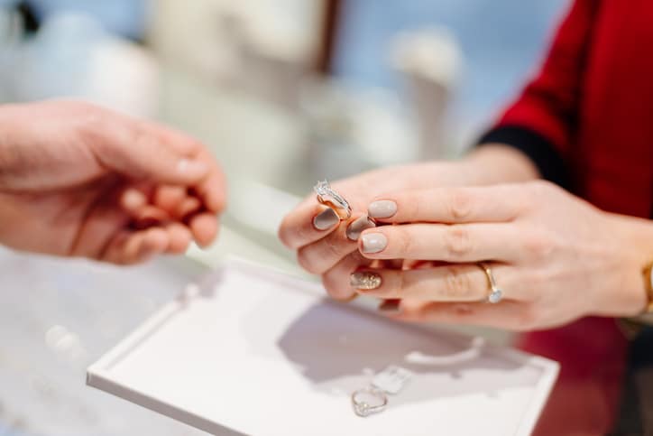 A woman shows a diamond ring that she is looking to sell in Baltimore, MD