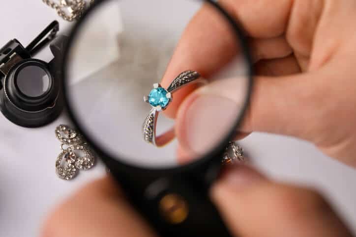 a jewelry appraiser inspecting a ring