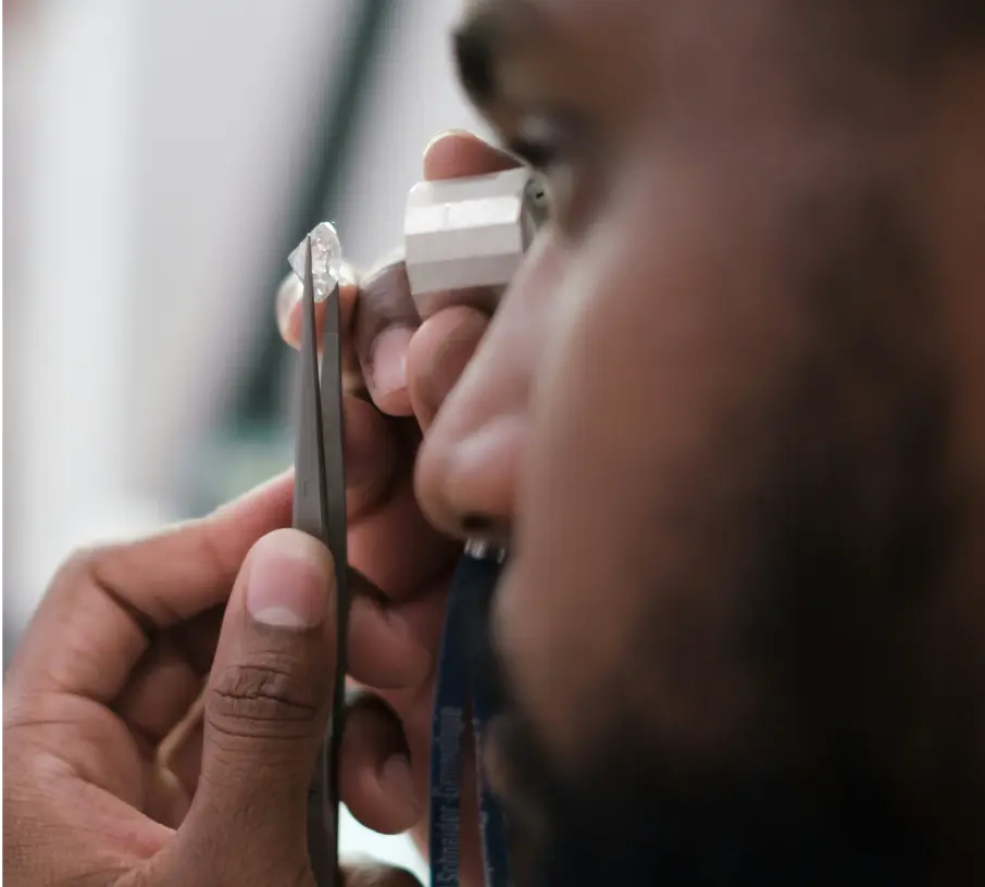 gemologist inspecting a loose diamond